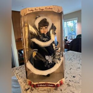 Elegant Winter Porcelain Doll with Silver Accents